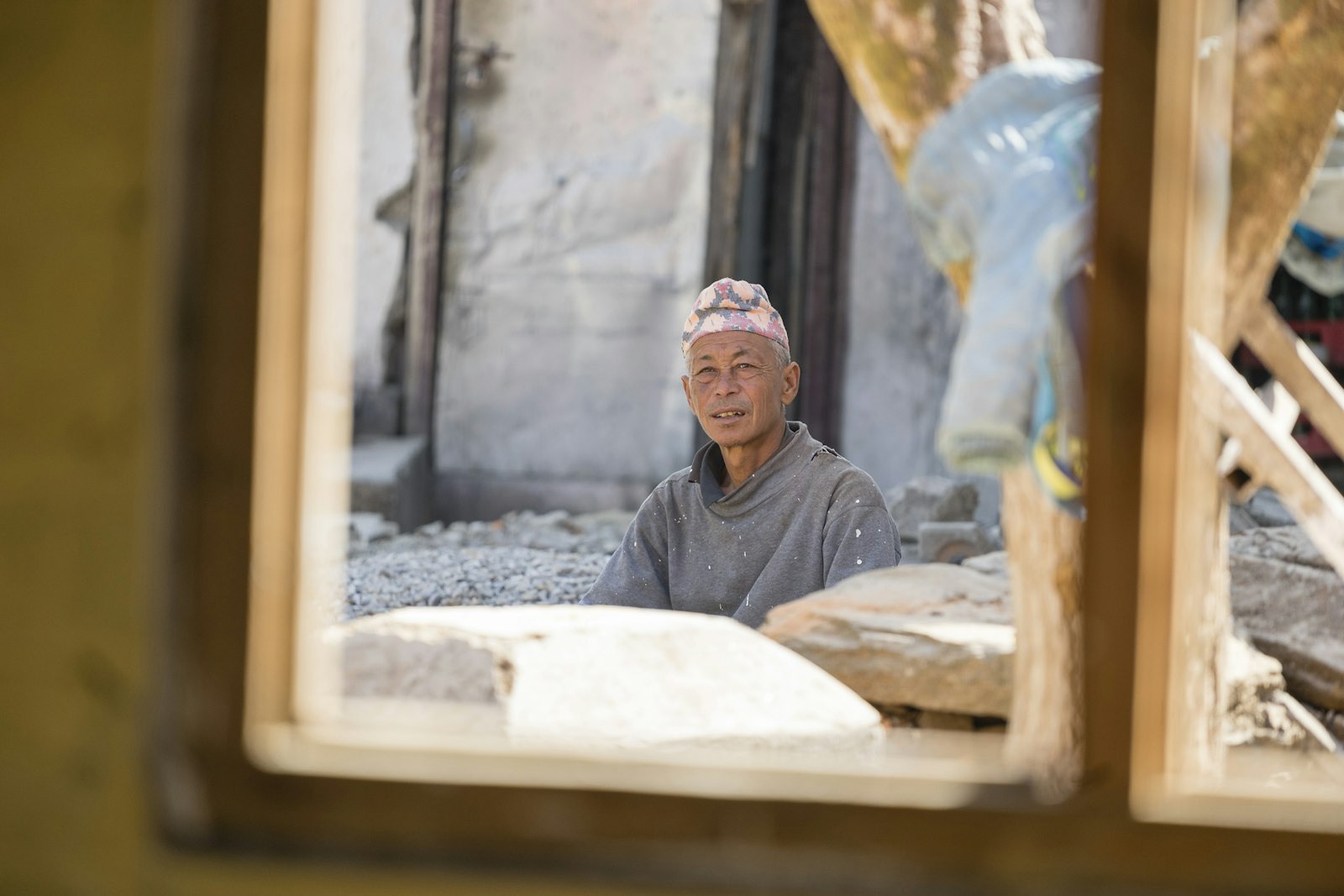 Photo: Michael Weibel · Unsplash Portrait of a carpenter with wall framing behind